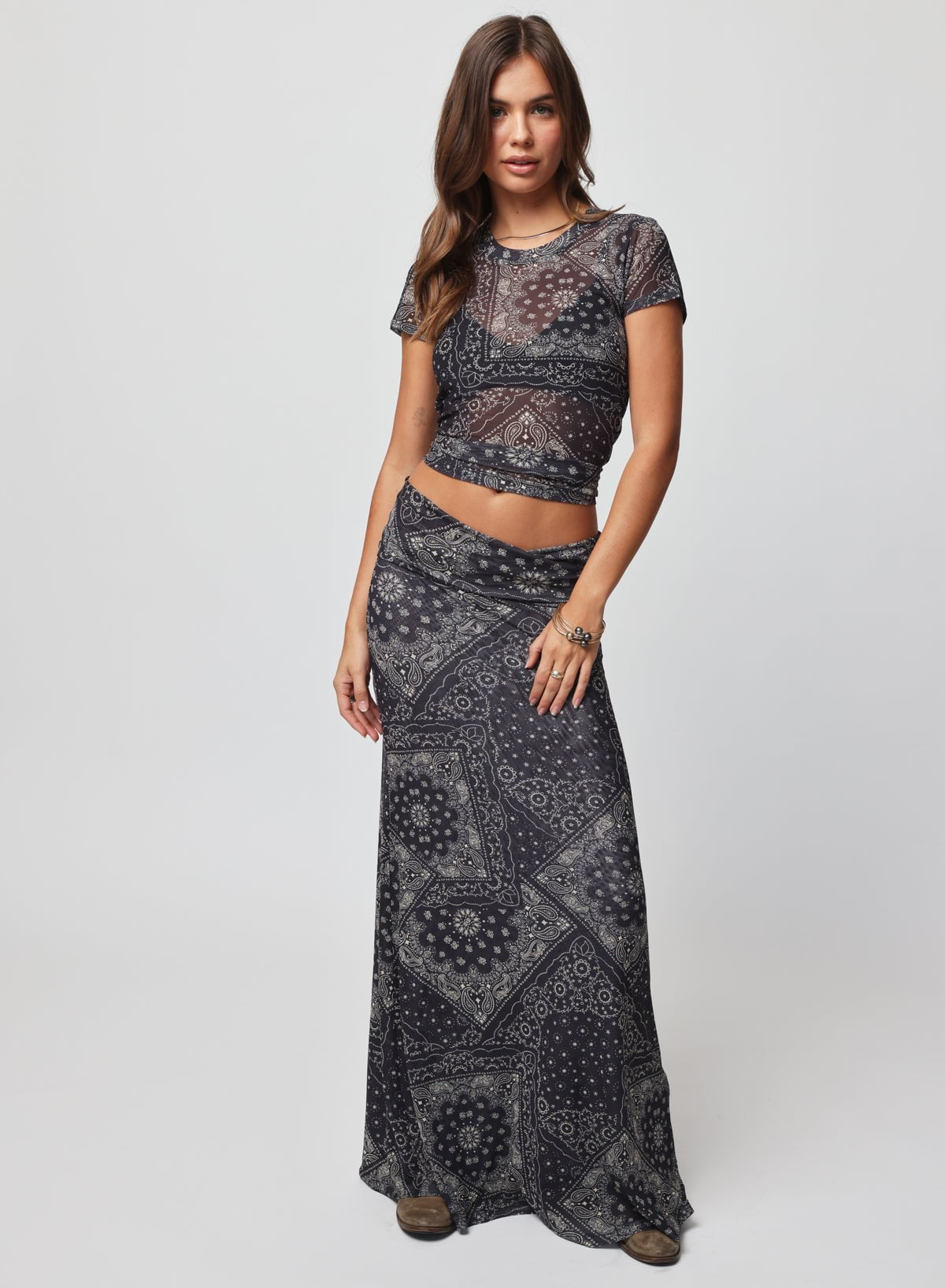 Woman wearing a black patterned outfit