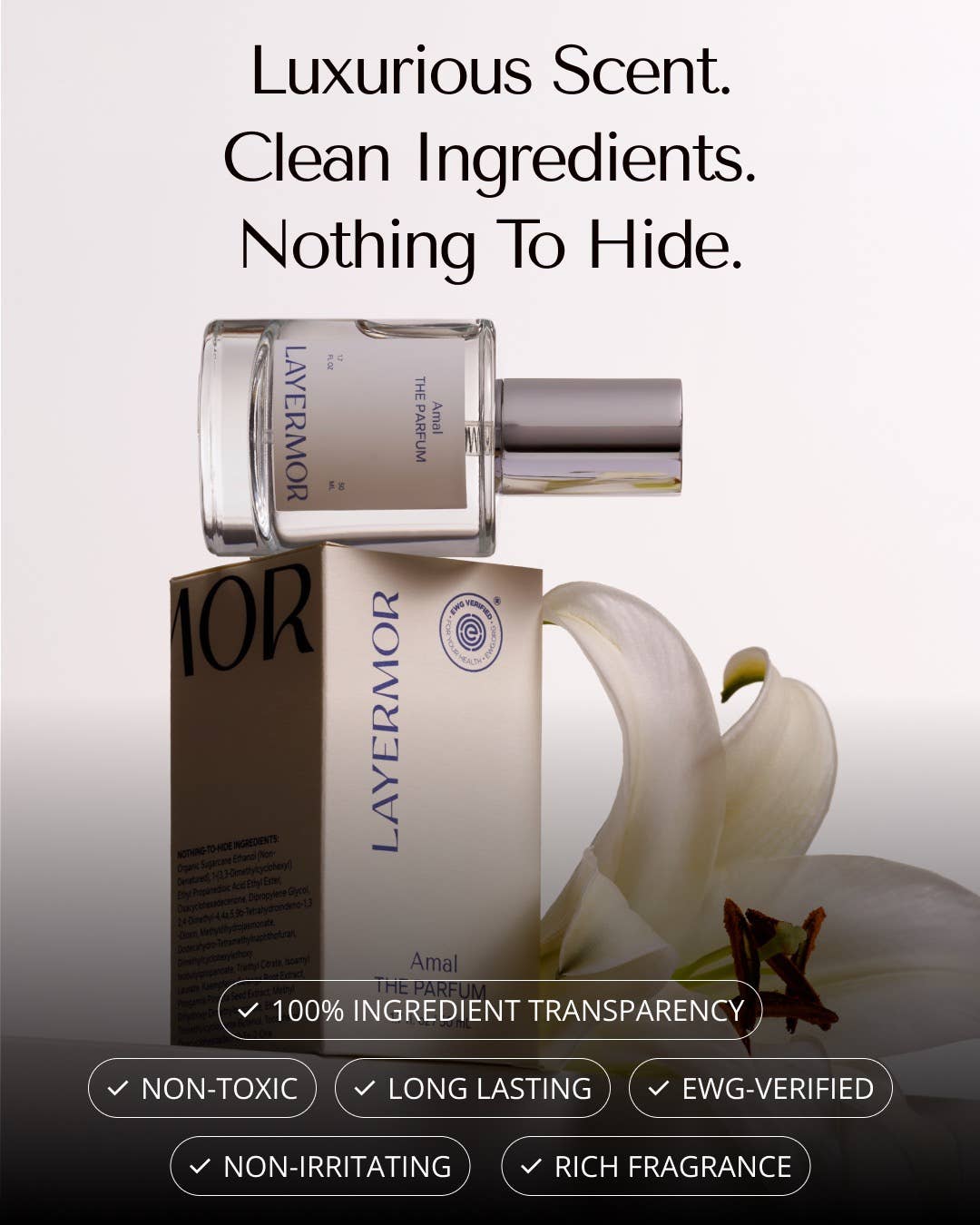 Clear glass perfume bottle and box with white lily design, EWG-certified clean ingredients.