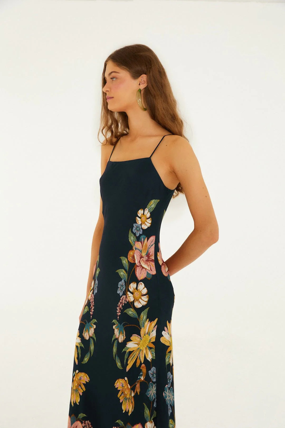 Dark blue floral maxi dress in lightweight fabric, shown on a woman against a white background. Suitable for casual or formal use.