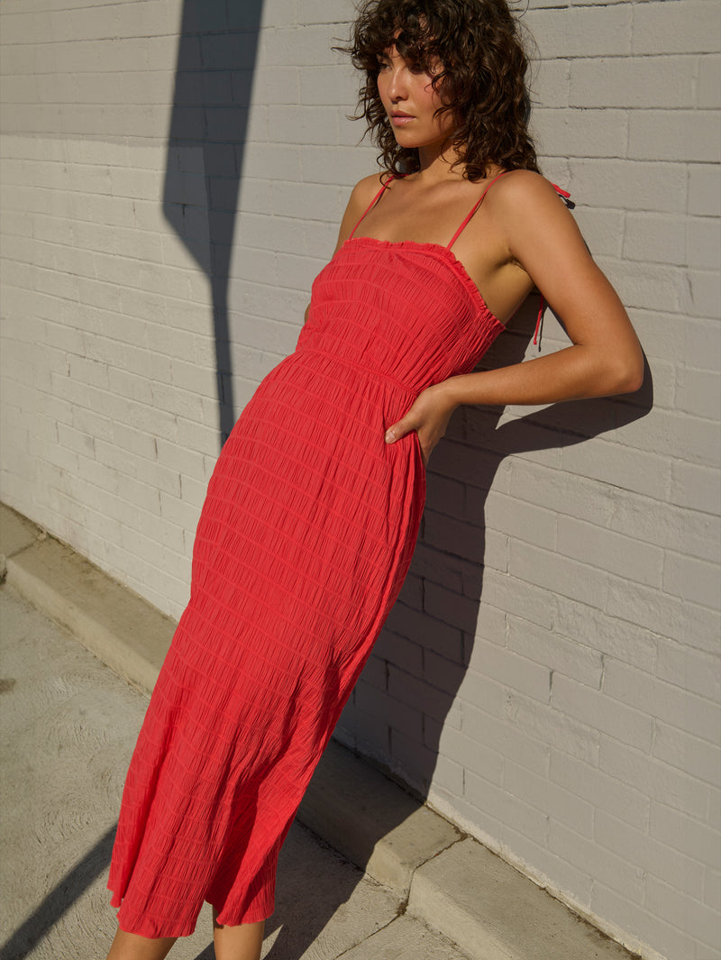Woman in a red midi dress