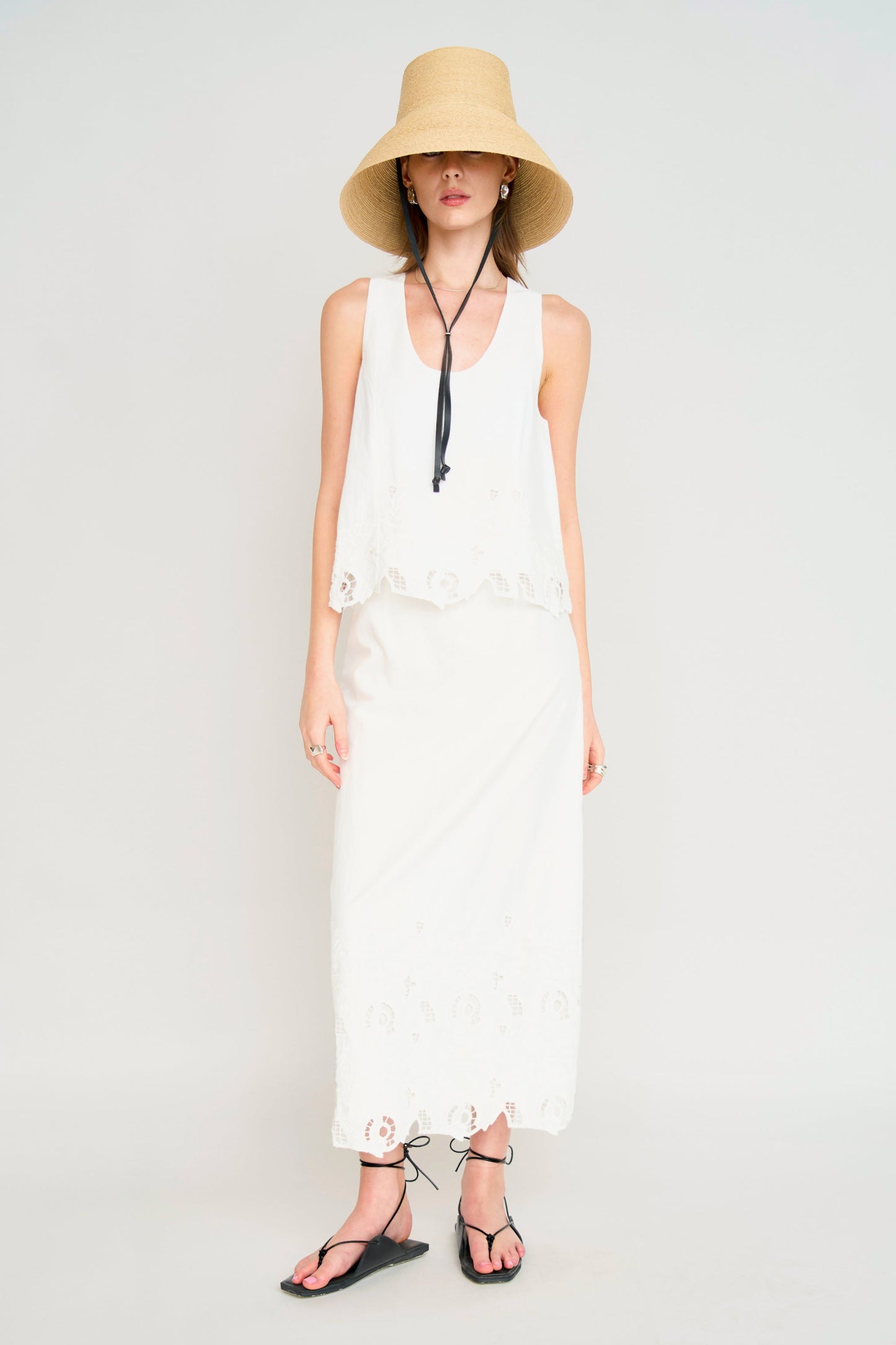 Woman in a white embroidered top