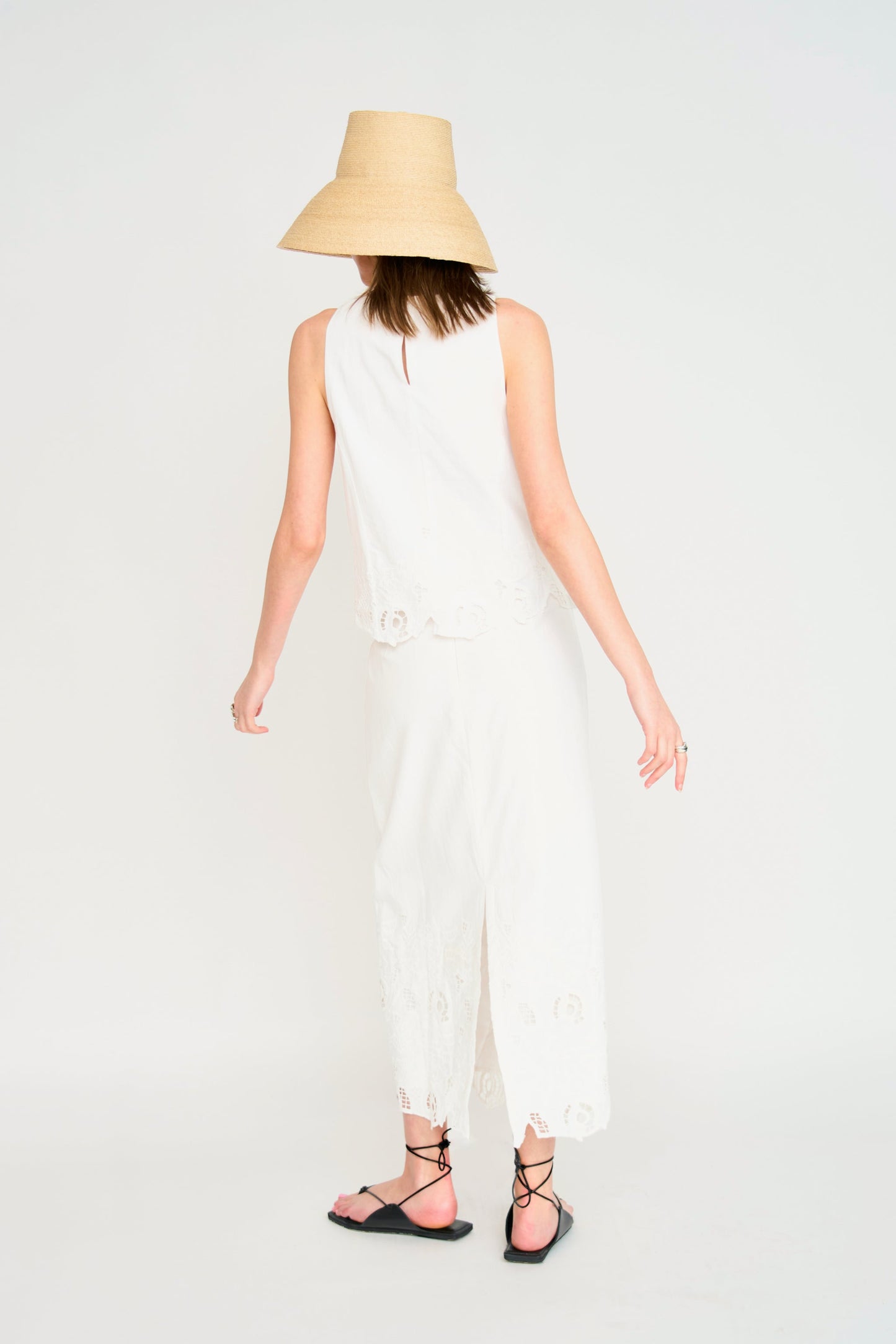Woman in a white embroidered skirt