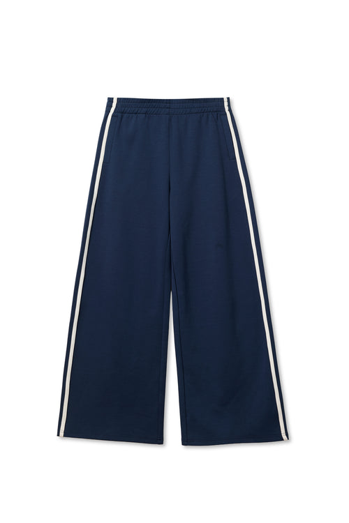 Navy wide-leg pants with white side stripes and elastic waist, cotton material, displayed flat on a white background.