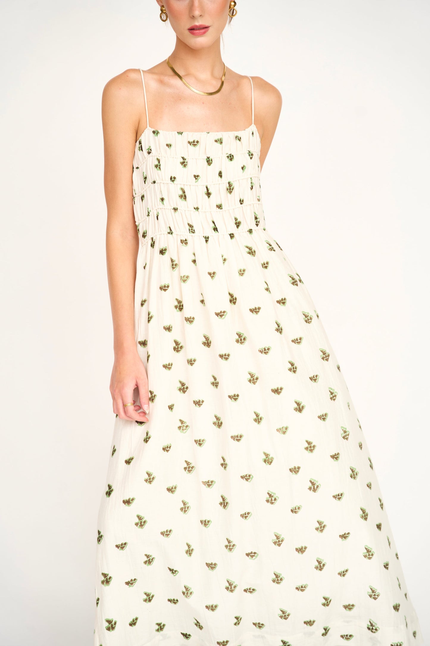 Woman in a white patterned dress