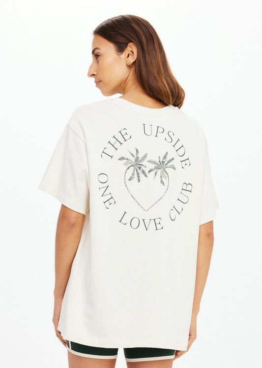Cream-colored tee with palm logo and ONE LOVE CLUB text on back, suitable for casual wear.
