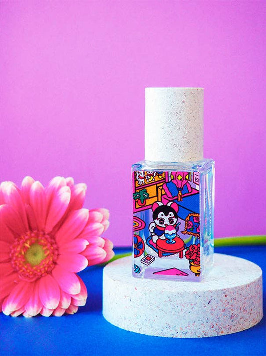 15ml perfume bottle with playful cartoon graphics, pink daisy detail, and a pink-blue background.