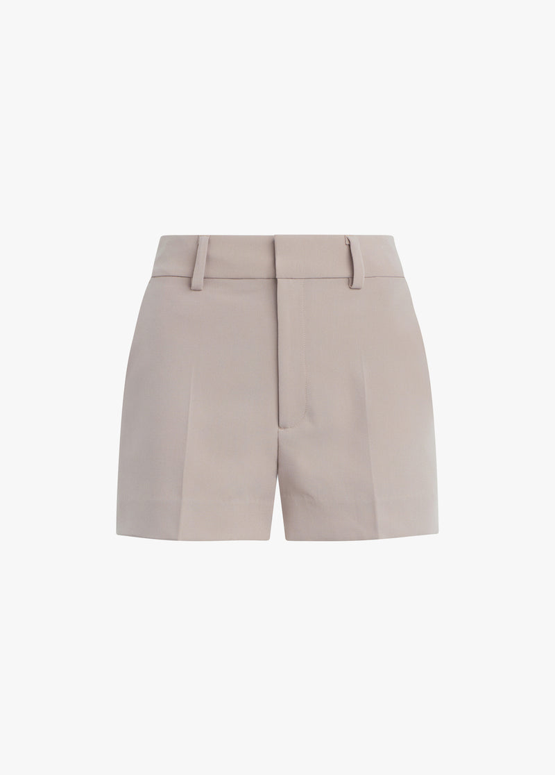 Soft taupe cotton-blend mini short with belt loops and a front zipper, designed for everyday wear.