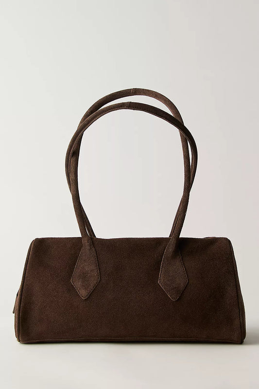 Chocolate suede shoulder bag with two long handles, ideal for carrying essentials, displayed on a plain background.
