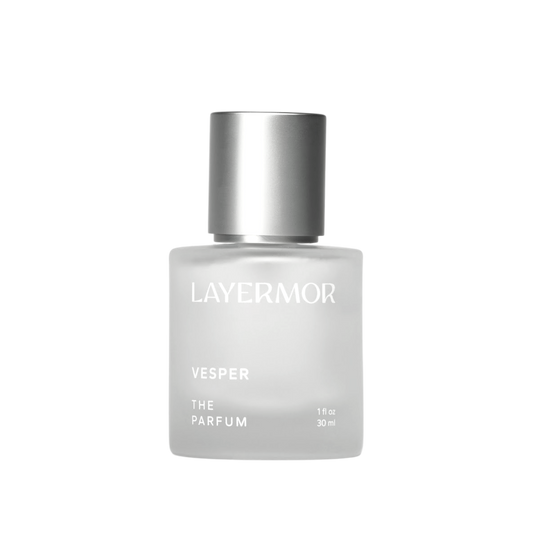 Frosted glass perfume bottle with silver cap, containing Layermor Vesper fragrance for personal use.