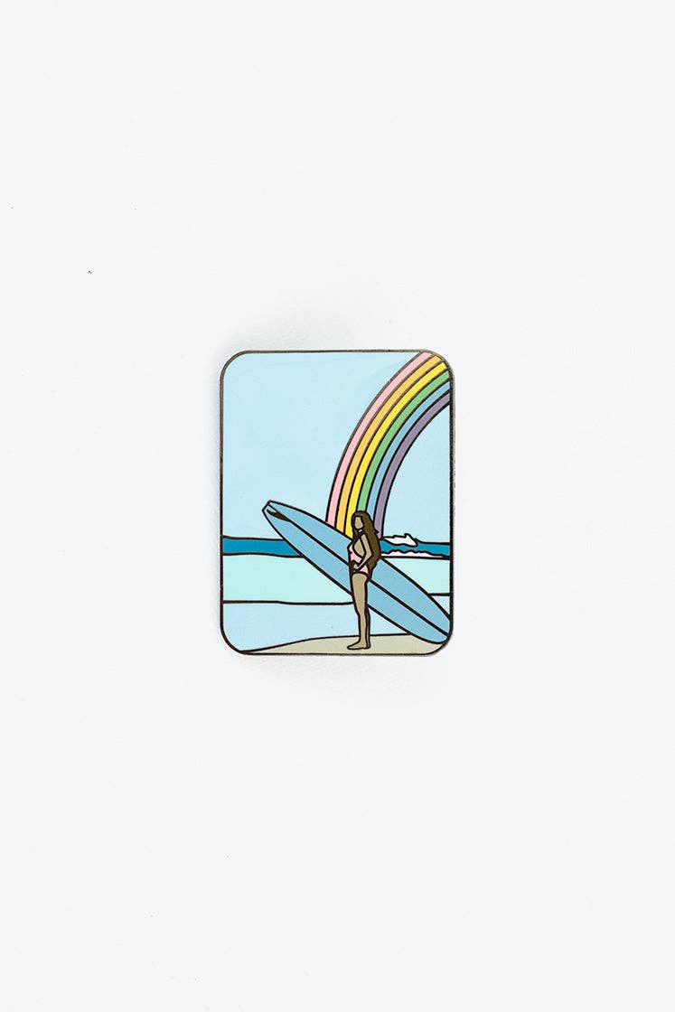Rainbow Surfer enamel pin showing a person with a surfboard under a colorful rainbow; metal and enamel accessory.