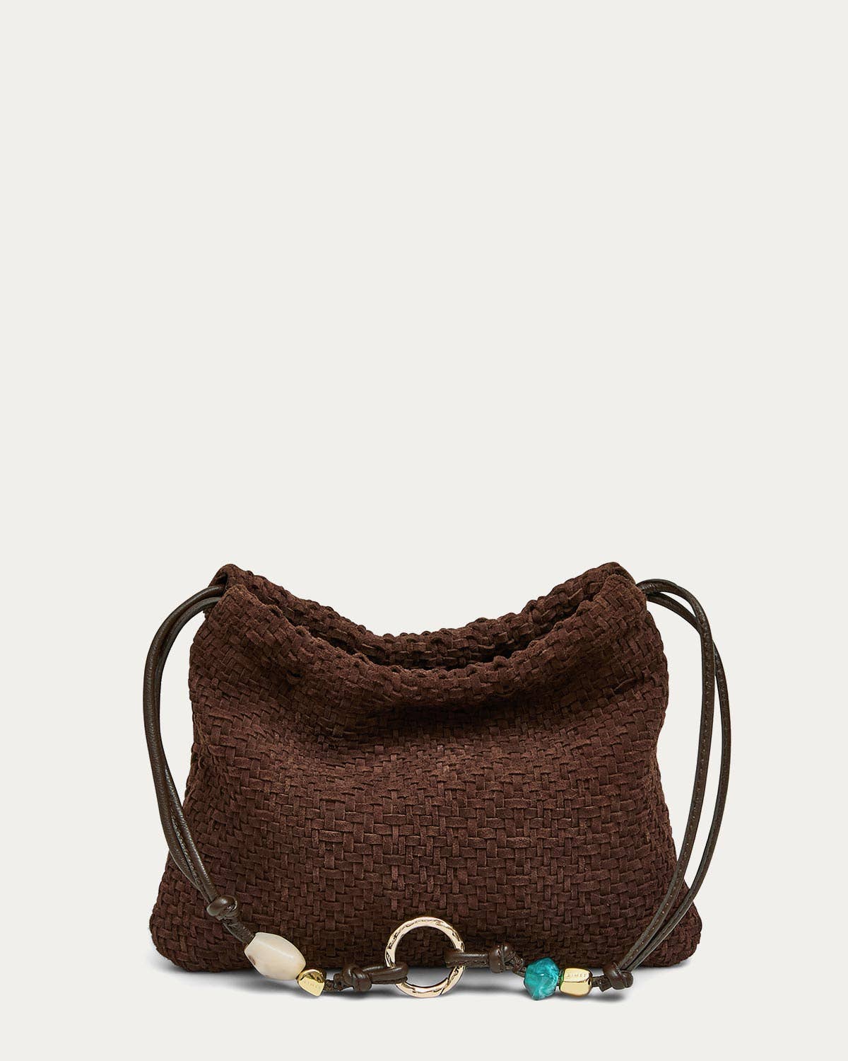 Shoulder bag in fudge woven suede with a beaded charm and metal ring detail on the strap, suitable for daily use.