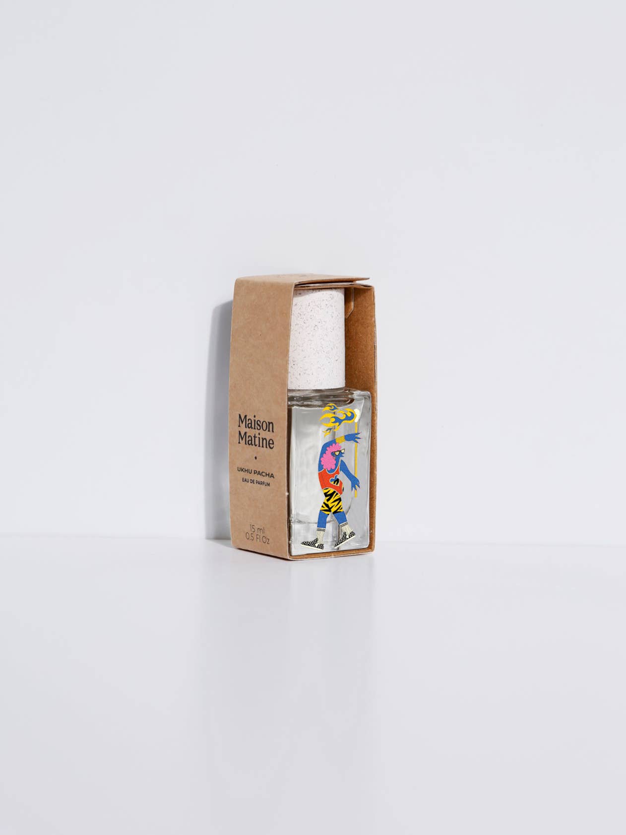 15ml Maison Matine Ukhu Pacha EDP with a white cap, partly in its box on a white background.
