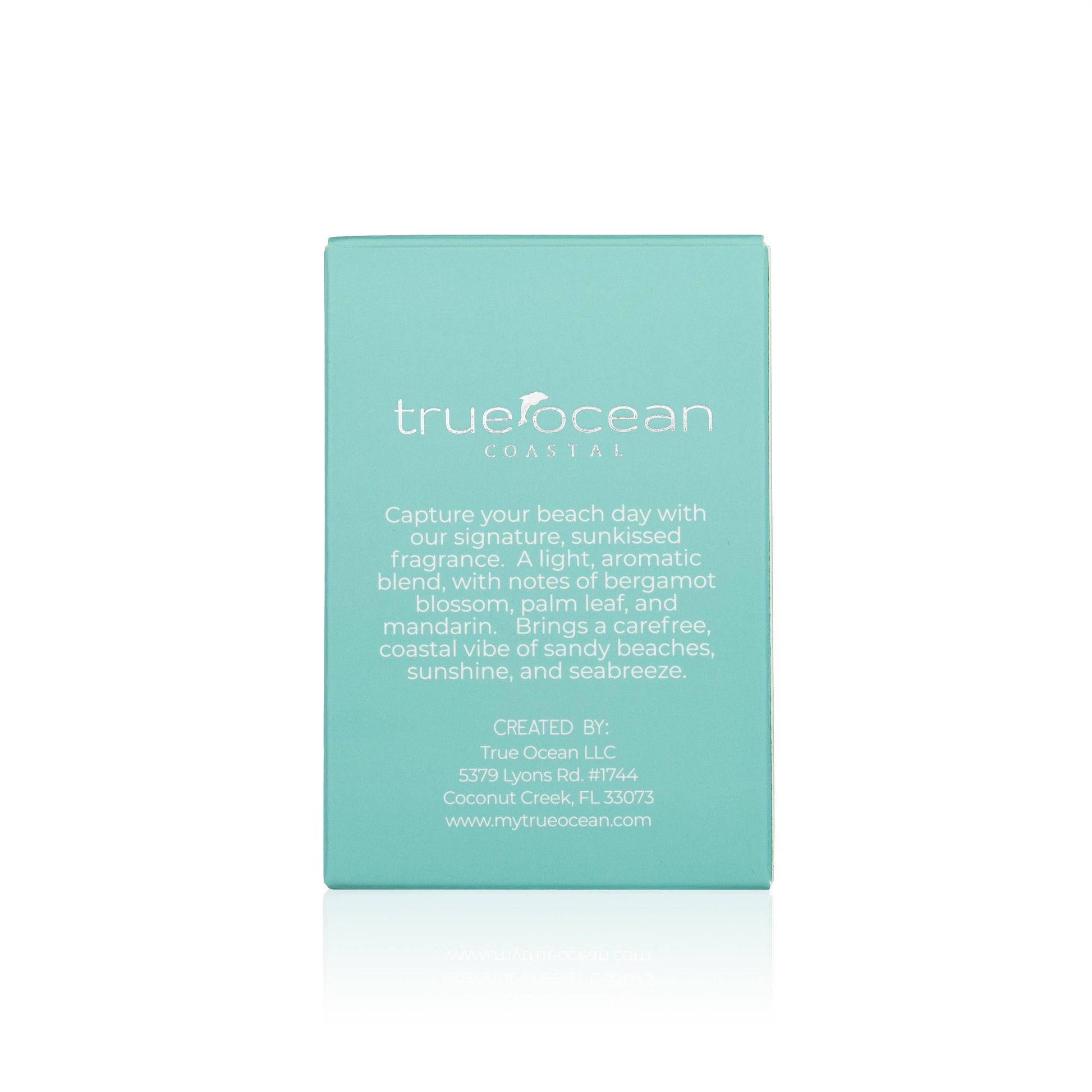Turquoise cardboard box for True Ocean Perfume—Coastal, with scent details and contact info printed on the back.