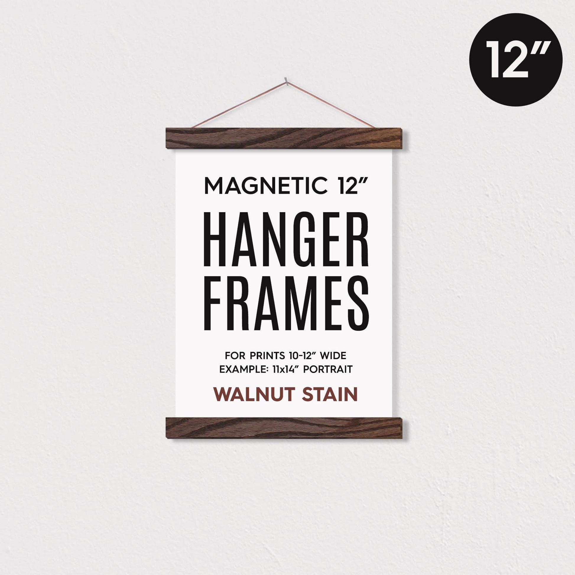 12 magnetic walnut-stained wooden poster hanger frame holding a poster against a white wall.