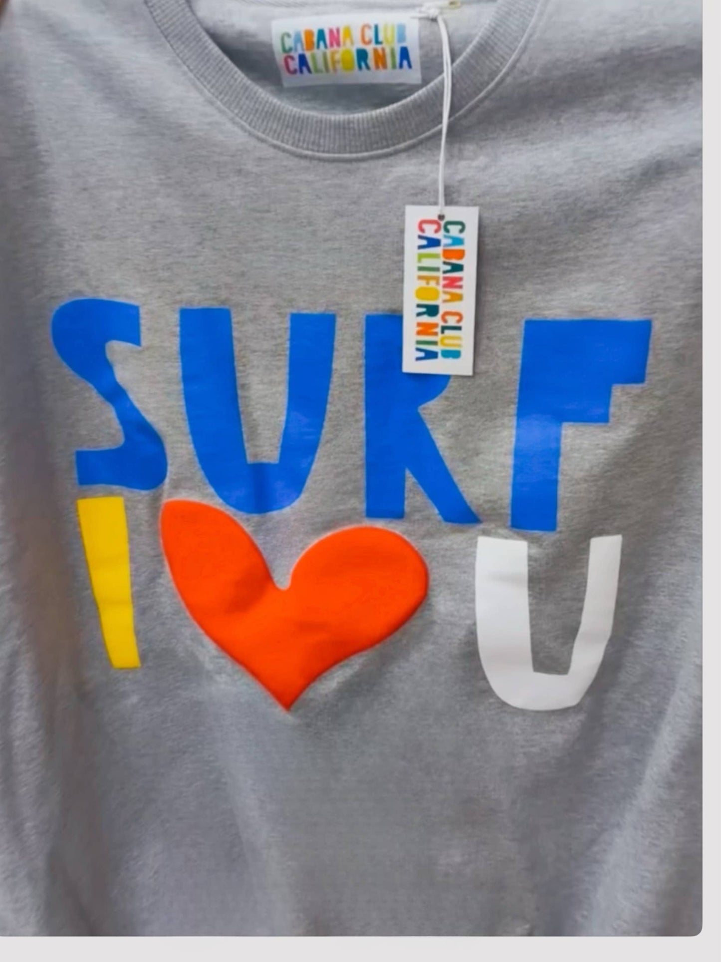 Grey cotton crewneck with multicolored blue, yellow, white, and red lettering. Comfortable choice for casual wear.