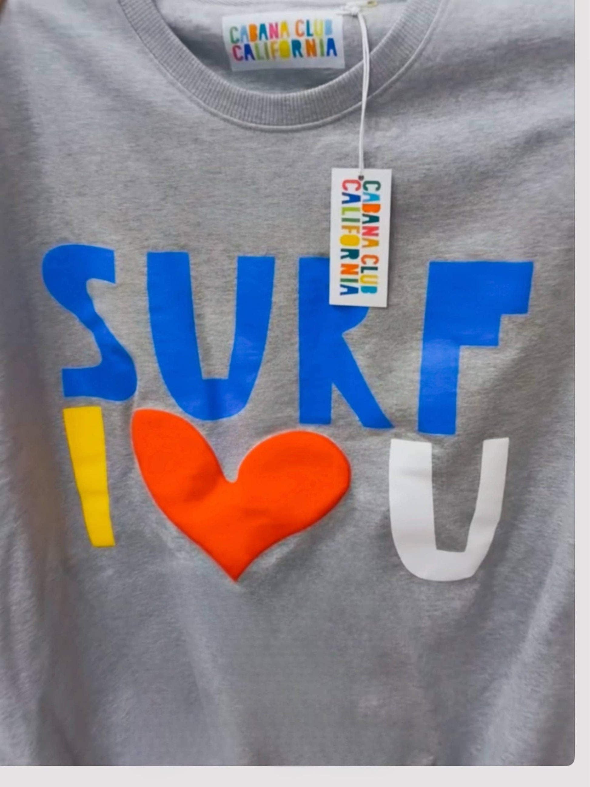 Grey cotton crewneck with multicolored blue, yellow, white, and red lettering. Comfortable choice for casual wear.