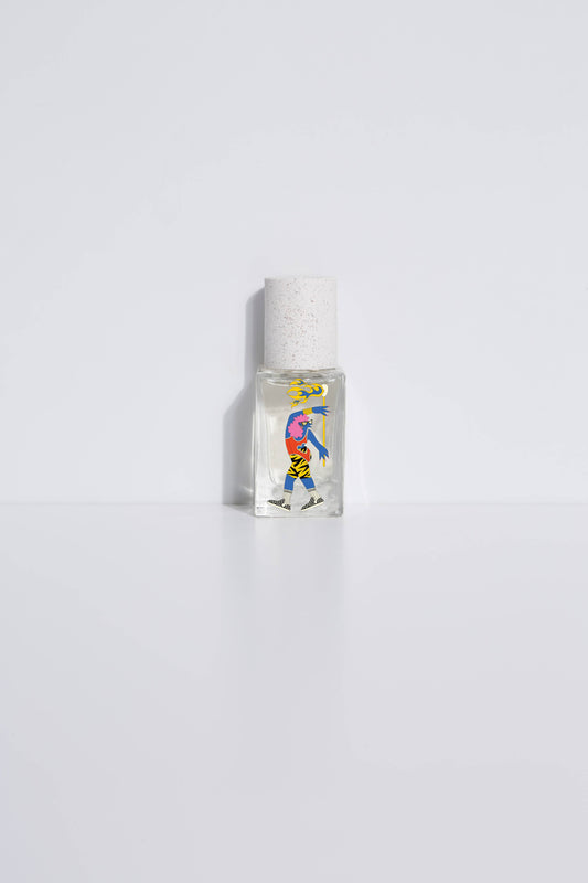 Clear glass 15ml perfume bottle with abstract art label, designed for personal fragrance, shown on a white surface.
