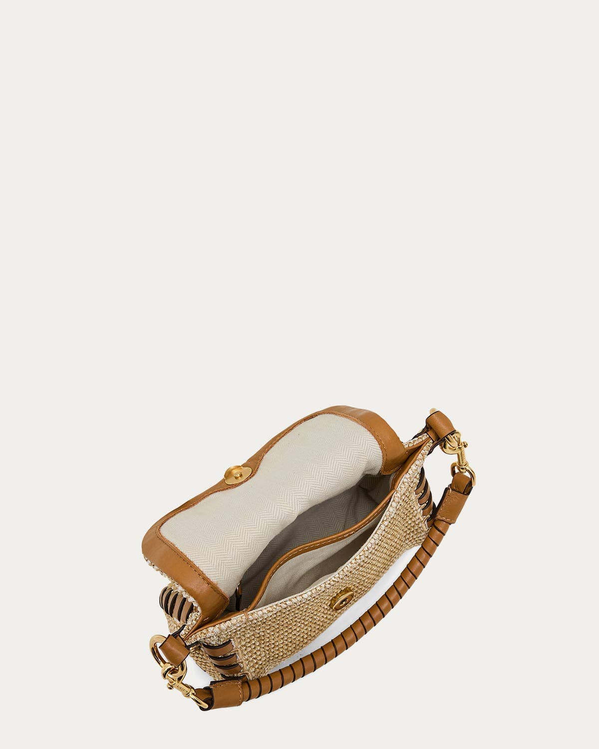 Tan leather-trimmed open weave mini crossbody bag with gold hardware and inner pockets, shown from top view.