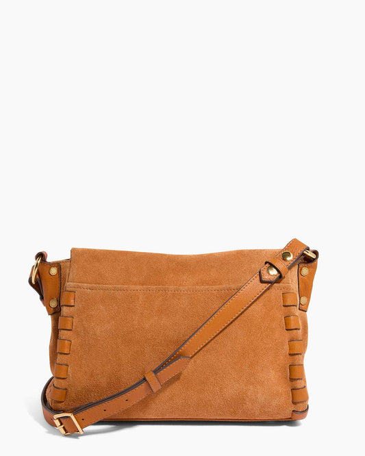 Rustic caramel suede crossbody with whipstitch detail and adjustable strap, displayed on a white background.