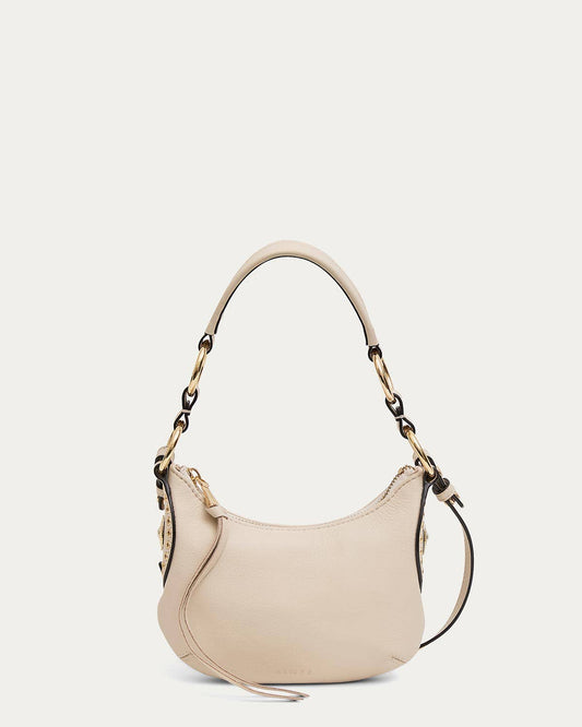 Beige leather mini crossbody bag with gold chain and wide strap, ideal for daily use.
