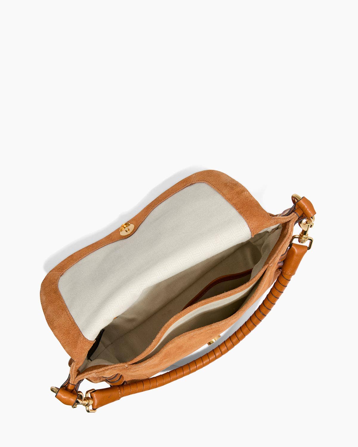 Tan hand-woven leather crossbody bag with textured handle, light interior, and multiple pockets for daily use.