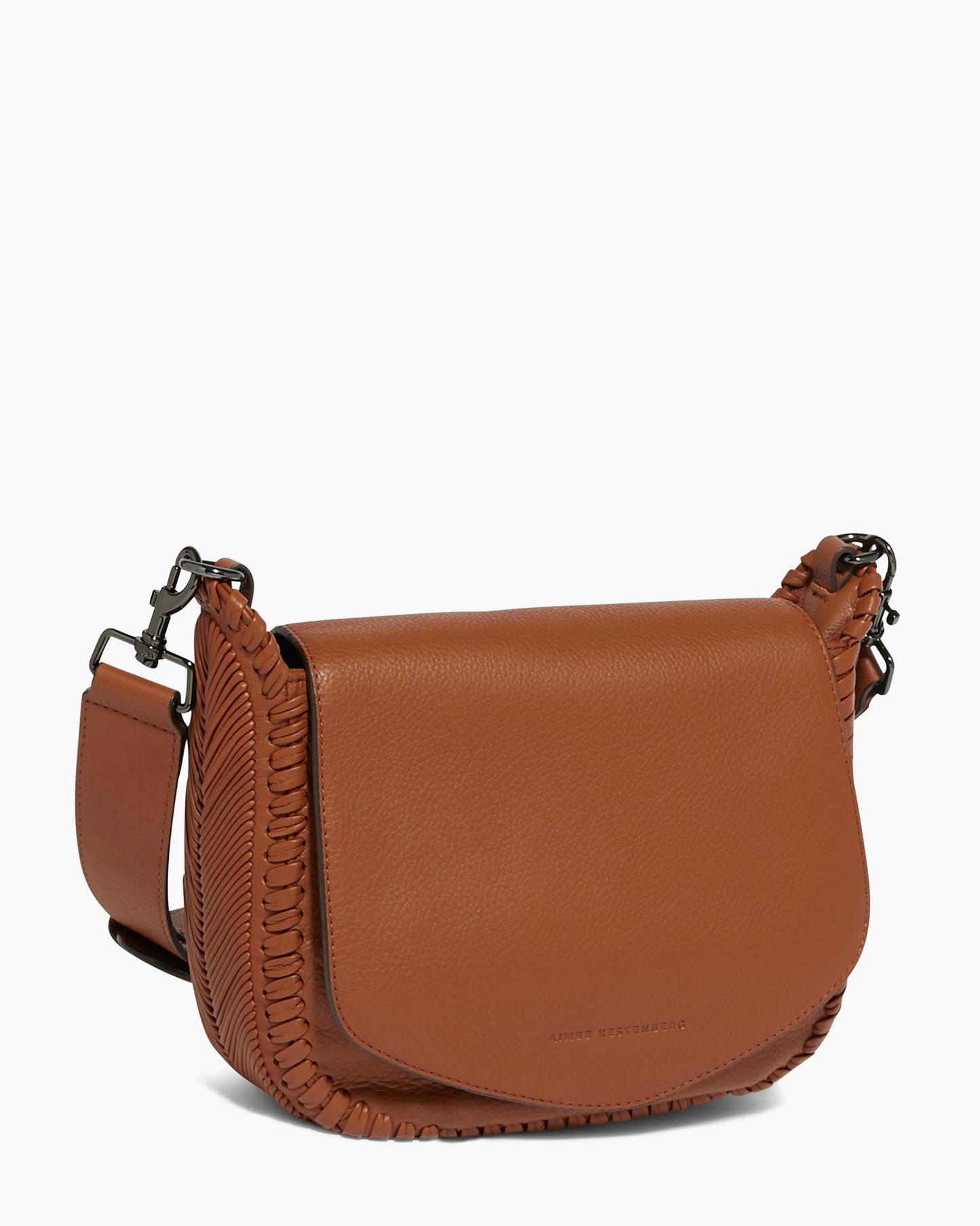 Brown leather crossbody bag with flap closure, wide adjustable strap, and visible side stitching.