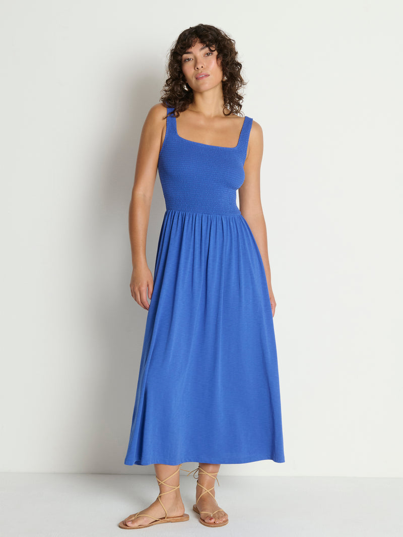 Woman wearing a blue midi dress 