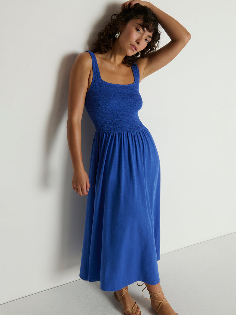 Woman wearing a blue midi dress 