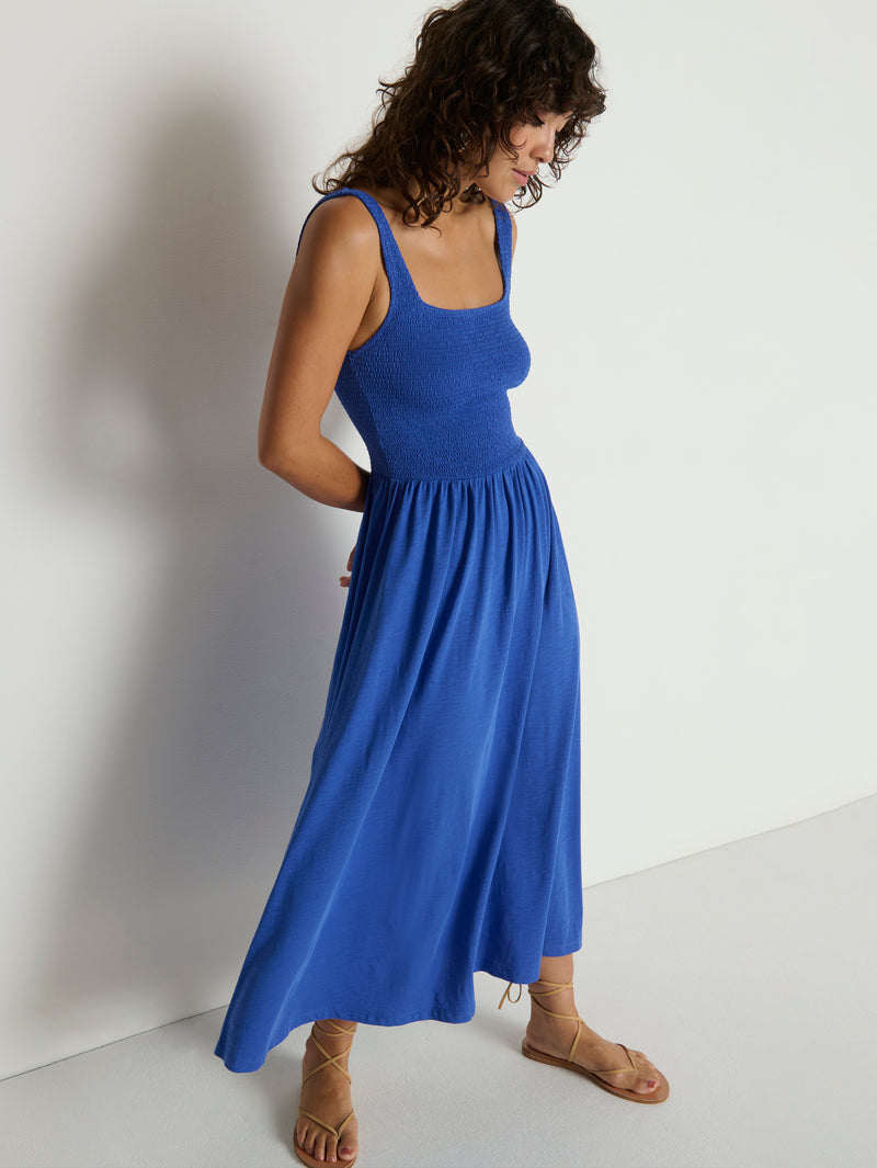 Woman wearing a blue midi dress 