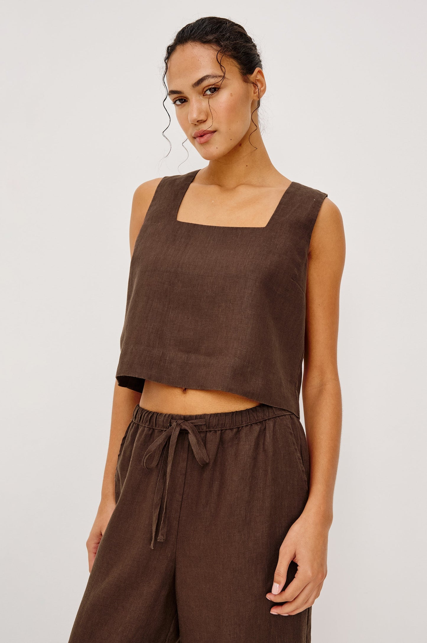 Espresso-colored linen top with square neckline, paired with matching drawstring pants, suitable for casual wear.