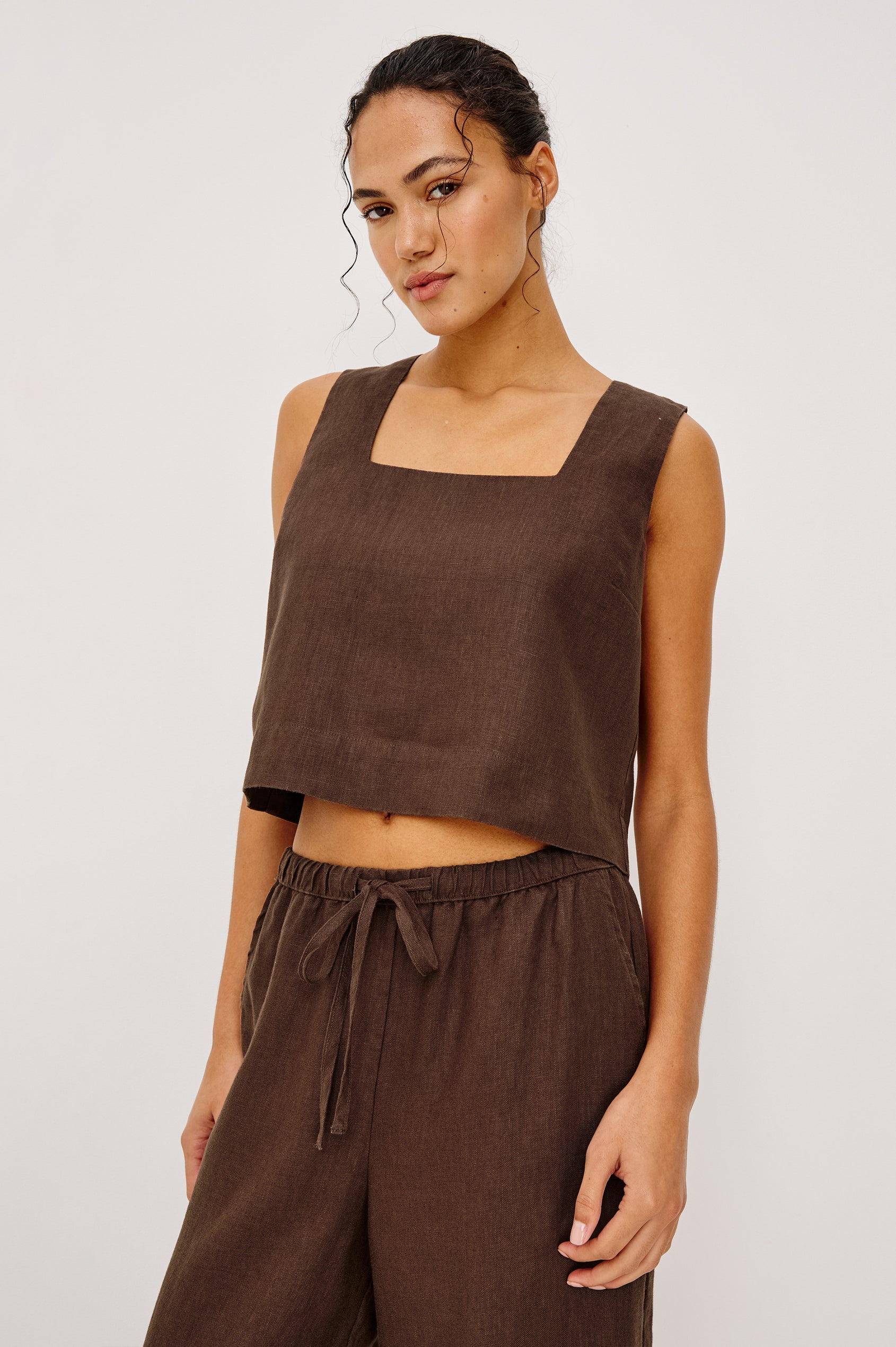 Espresso-colored linen top with square neckline, paired with matching drawstring pants, suitable for casual wear.