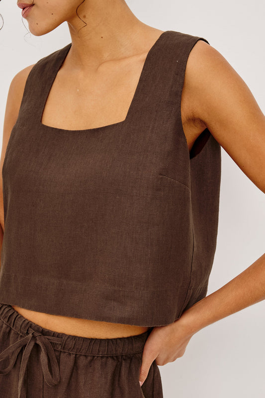 Sleeveless espresso linen top and matching drawstring pants, ideal for warm weather wear.
