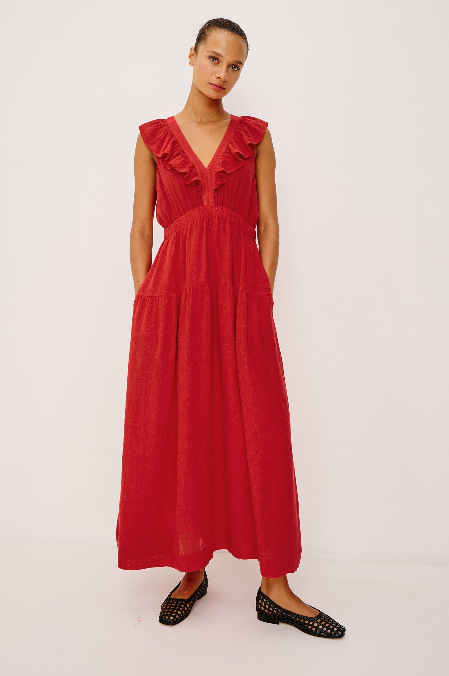 Woman wearing a red dress with ruffled details