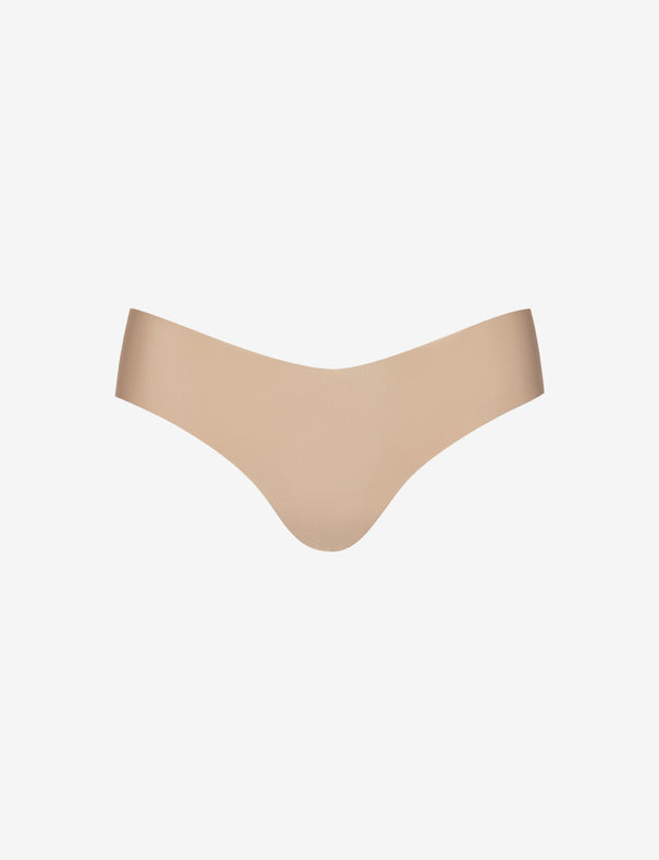 Beige ribbed one-size thong with raw-cut edges, designed for seamless wear, displayed on a white background.