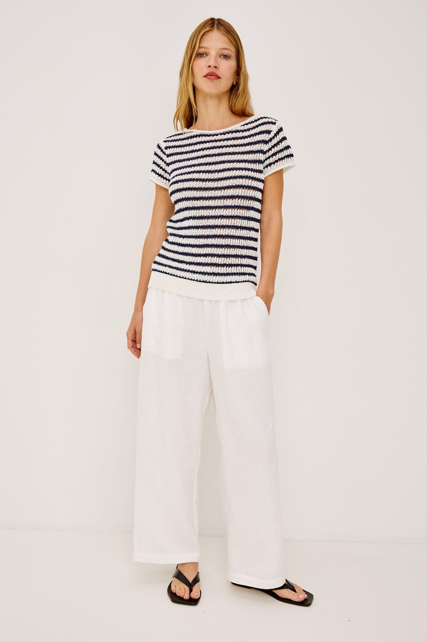 Woman wearing an indigo striped shirt 
