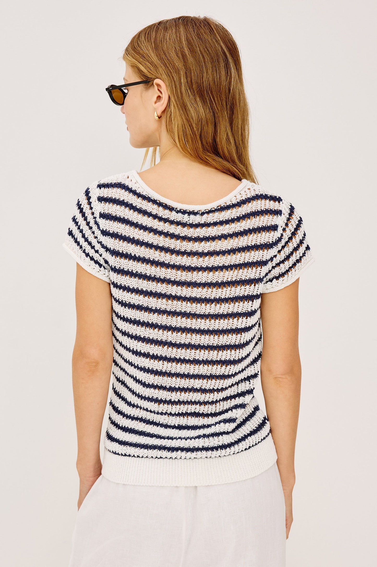 Woman wearing an indigo striped shirt 