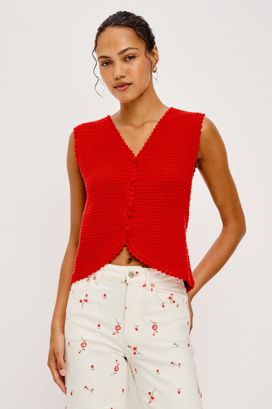 Woman wearing a red sleeveless top