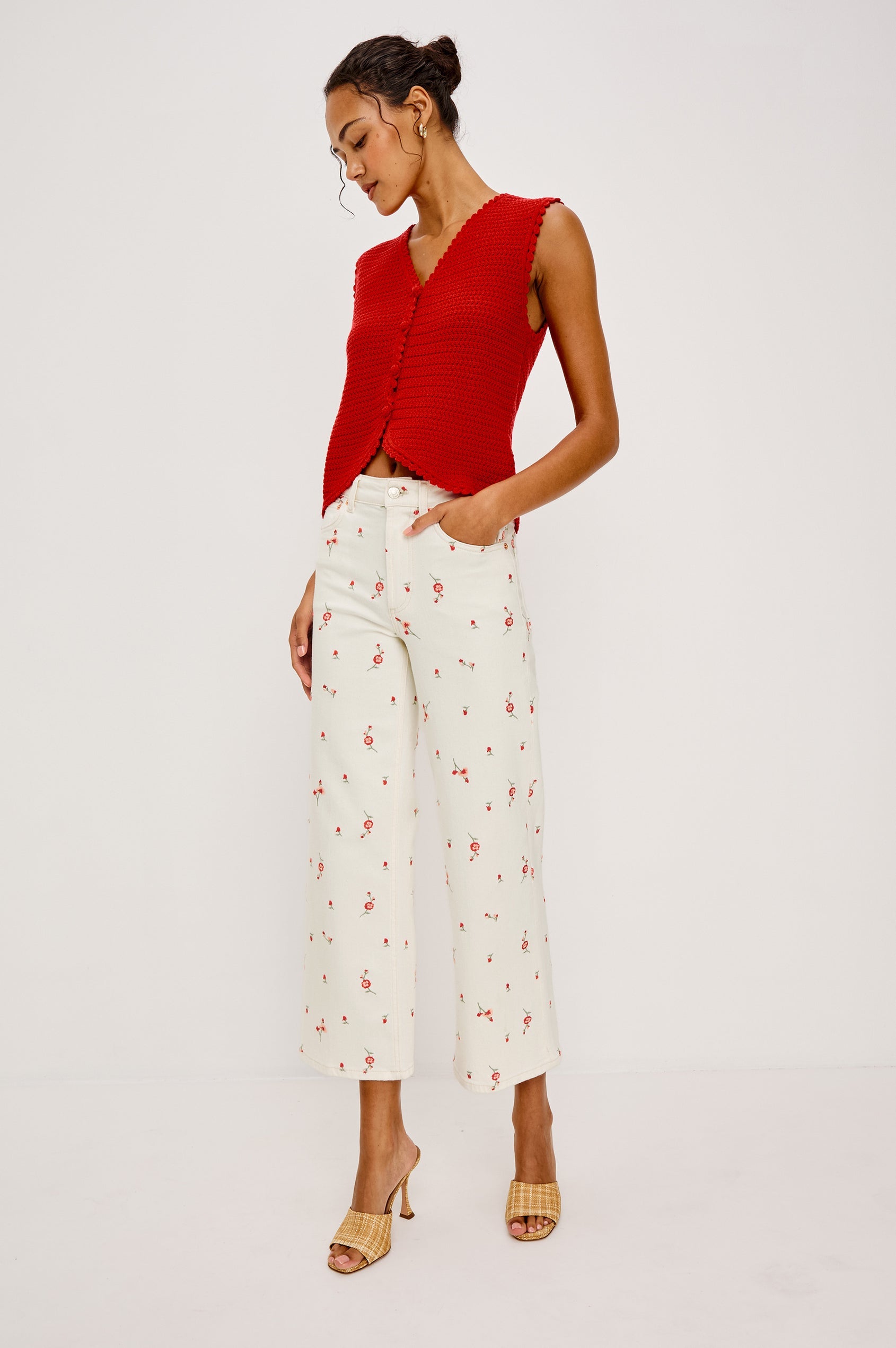 Woman wearing a red sleeveless top
