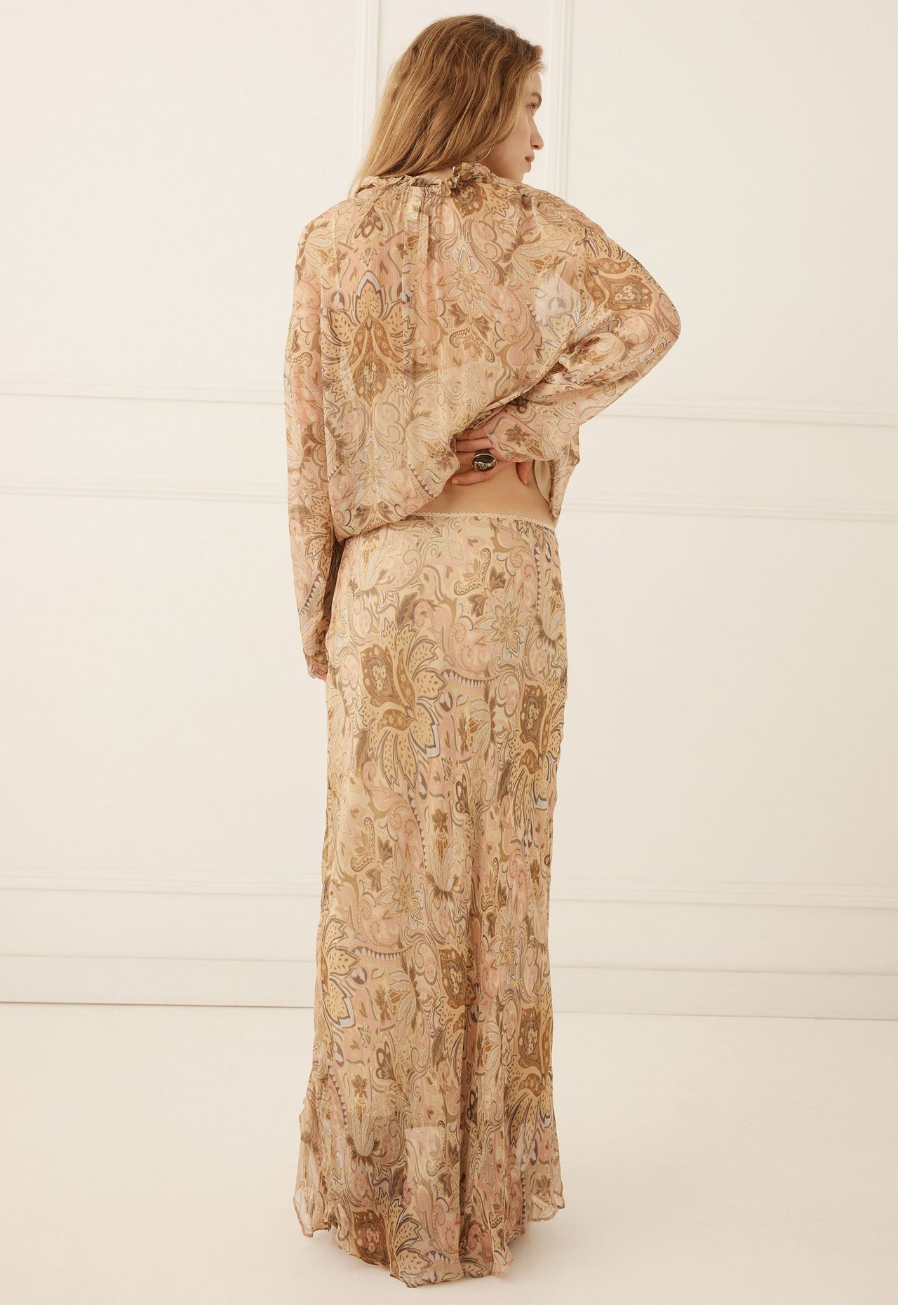 A woman in a patterned skirt 