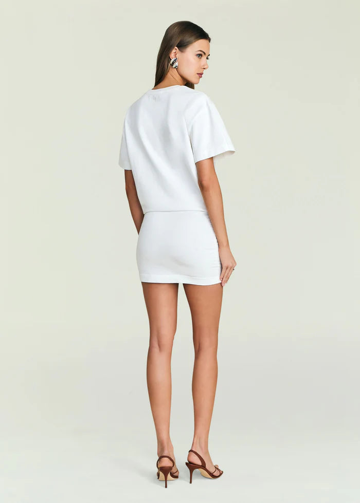 Ivory satin dress with strappy heels, shown from the back against a plain background. Ideal for formal or evening wear.