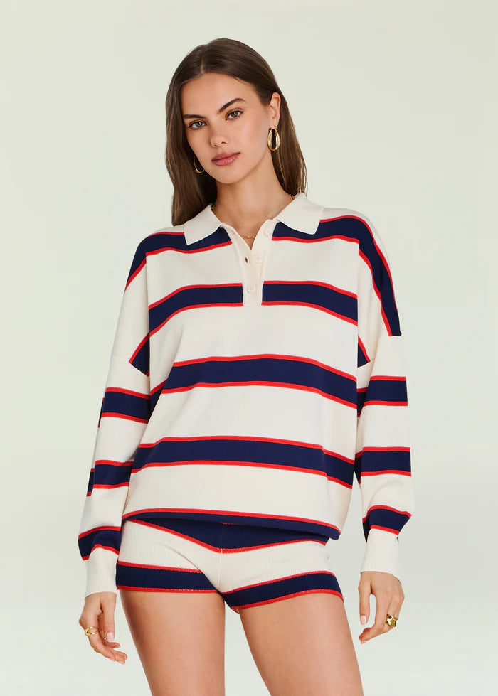 Woman in off-white striped sweater and matching shorts, lightweight knit, suitable for casual wear. Made in China.