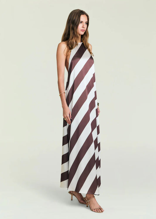 Sleeveless halter-neck maxi dress, brown and white stripes, worn with heels. Size S. Suitable for casual or summer wear.