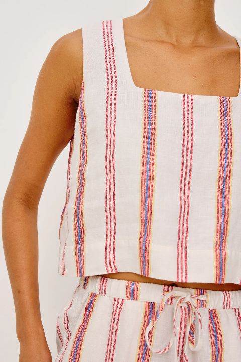 Sleeveless white linen top with colorful vertical stripes, ideal for warm weather.