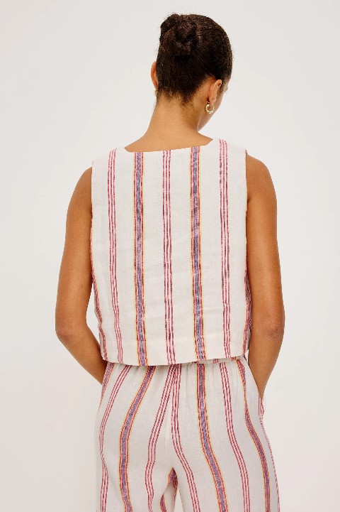 Back view of a woman in a sleeveless linen top with colorful vertical stripes, ideal for warm-weather wear.