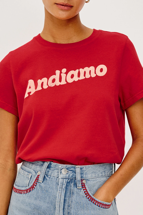 Red cotton crewneck T-shirt tucked into high-waisted light blue jeans; comfortable for everyday casual wear.