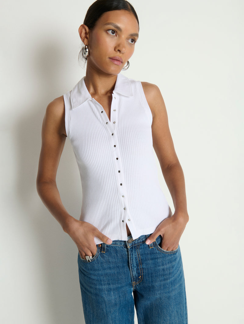 Woman wears a white cotton polo top 