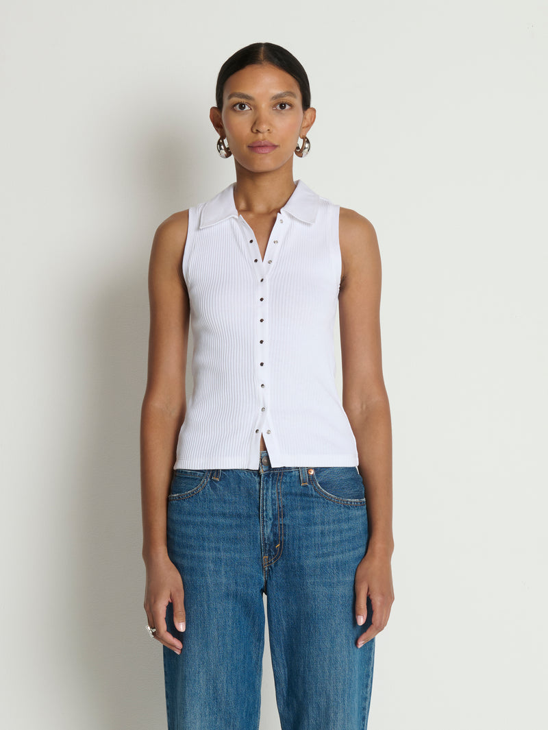 Woman in a white polo top 