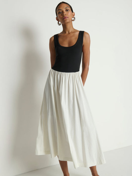 Woman wearing a black & white midi dress