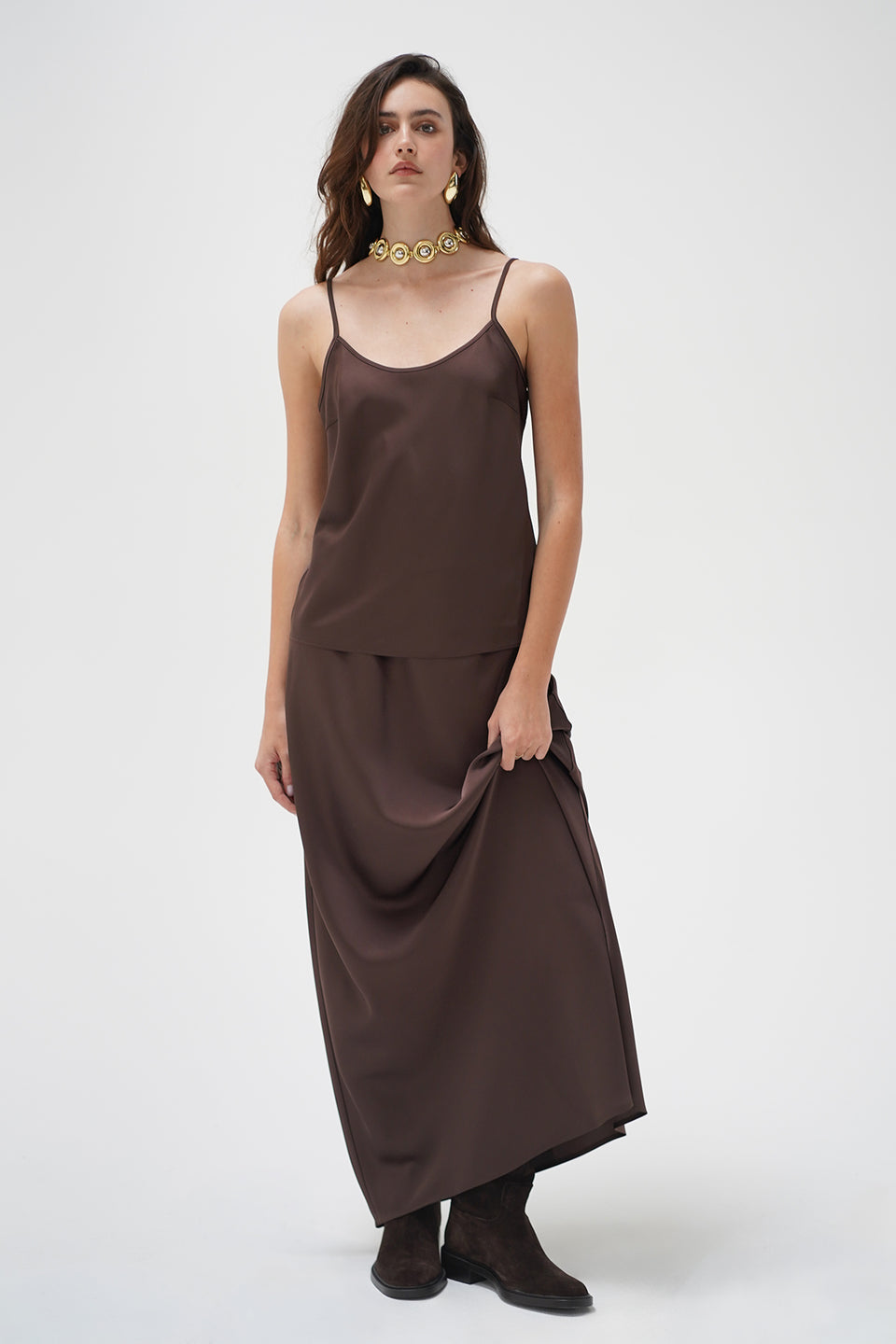A woman modeling a dark brown tank top