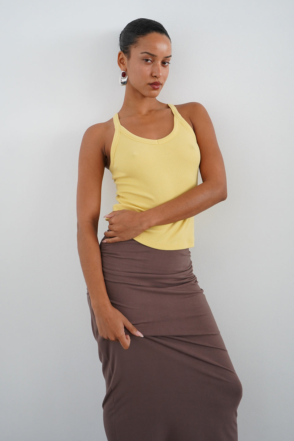 Woman wearing a yellow tank top